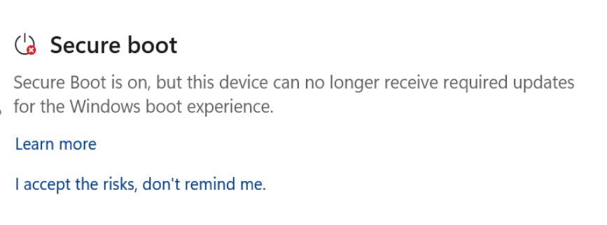 The Secure Boot section showing the “Requires action” status with a red stop icon.